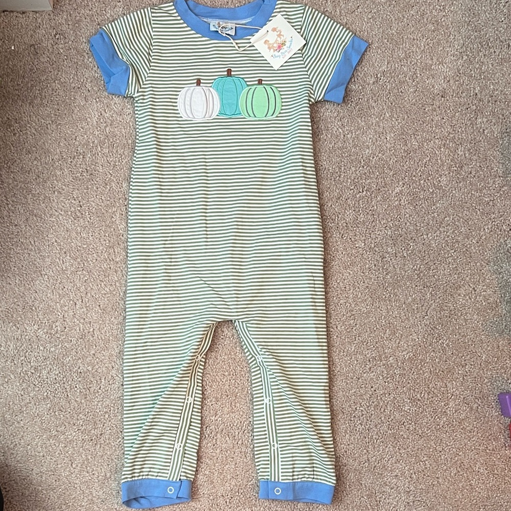 Sage green and white striped short sleeve romper with pumpkin appliqué.